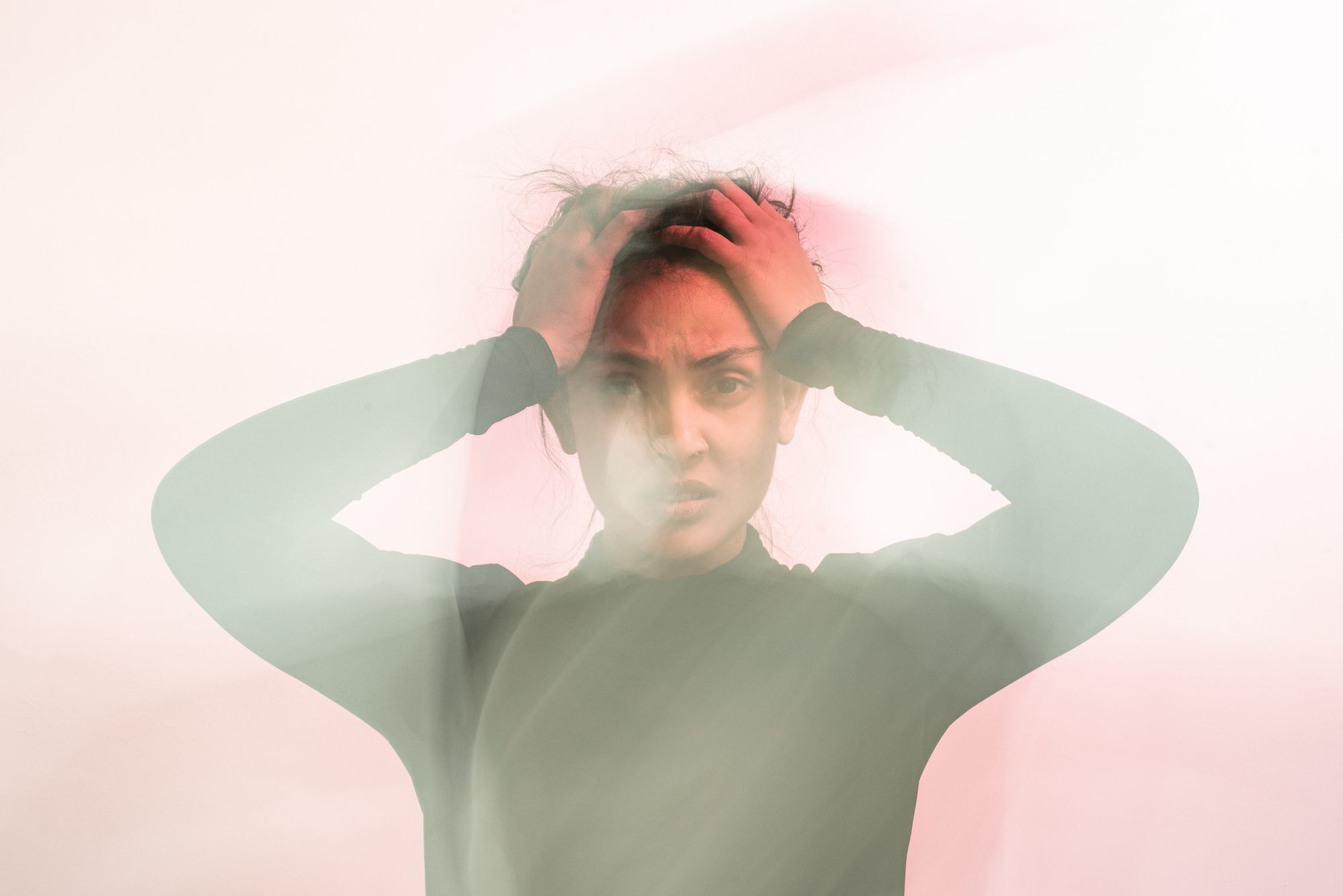 Woman holding her head in frustration