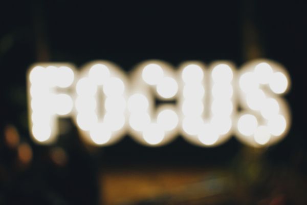 Photo of the word Focus in lights, which is out of focus